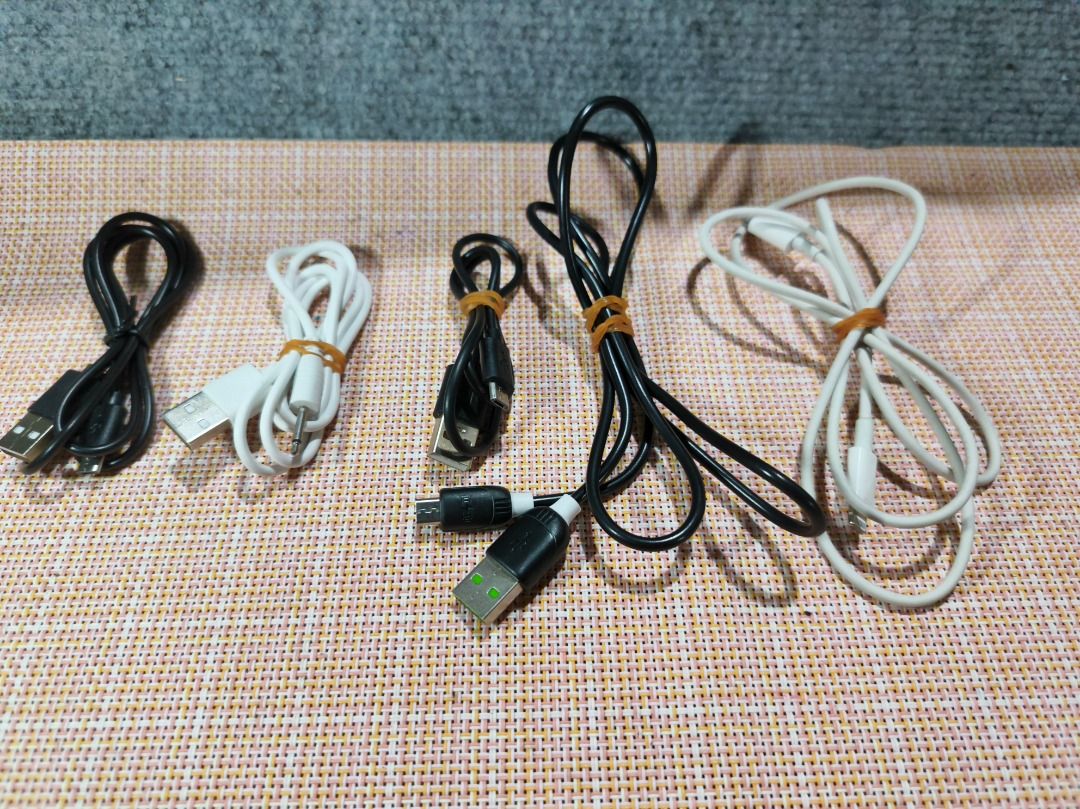 Assorted USB Charging & Audio Cable Bundle (5-Piece Lot) (Category: Chargers & Cables) located in San Leonardo. Submitted by burgossanleonardo.12345 (Listing ID 1462191226, Image 2). Description: Description:Selling a bundle of 5 useful electronic cables in good condition. Great to keep as spares for your home, car, or office!The lot includes:2x Standard Micro-USB Cables (Black)1x Dual-Split Micro-USB Charging Cable (Black)1x Apple iPhone Lightni