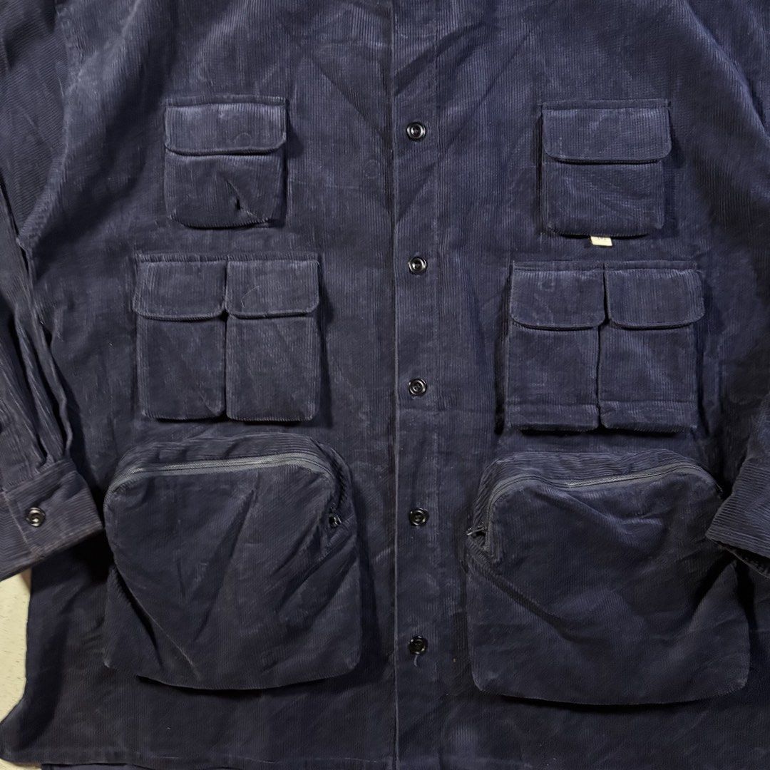 ASUSL JP Multipocket Corduroy Button-down Longsleeves in Blue (Category: Coats, Jackets and Outerwear) located in Manila. Submitted by yama_archive (Listing ID 1462190350, Image 2). Description: ASUSL JP Multipocket Corduroy Button-down Longsleeves in Blue Dimes (inches starting from 0) — - Size on tag: L (can fit up to XXL) - Width: 26.5 - Length: 31 front / 34.5 back - Shoulders: 26 - Sleeves: 23 - Fabric: Corduroy cotton ₱1500 Issues: ❌ Condit