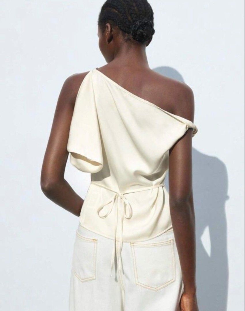 Asymmetric Cream Top (Category: Others Tops) located in Pasig City. Submitted by isntsheelvly (Listing ID 1462186064, Image 2). Description: Size XS Rfs: Not my style. Bought it here sa Carousel..
