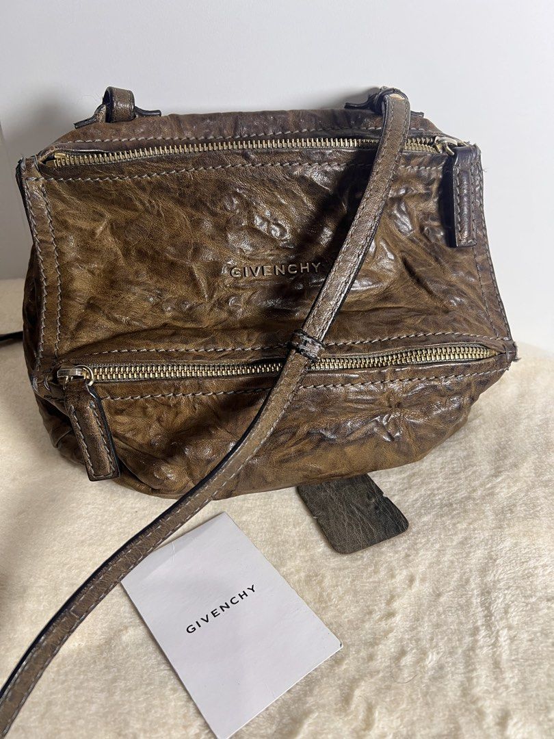 Authentic Givenchy Pandora Mini (Category: Luxury Bags & Wallets) located in Makati City. Submitted by carullee (Listing ID 1462194791, Image 1). Description: Guaranteed authentic Givenchy Pandora Mini 100% sheep leather Distressed leather brown With cert of authenticity With booklet and leather swatch Minimal sign of use.