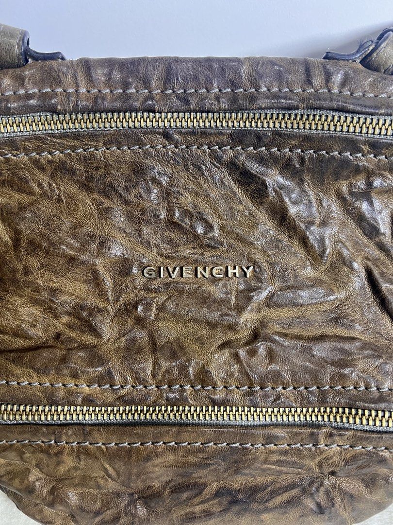Authentic Givenchy Pandora Mini (Category: Luxury Bags & Wallets) located in Makati City. Submitted by carullee (Listing ID 1462194791, Image 2). Description: Guaranteed authentic Givenchy Pandora Mini 100% sheep leather Distressed leather brown With cert of authenticity With booklet and leather swatch Minimal sign of use.