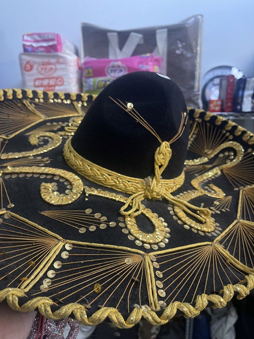 Authentic "Hecho en Mexico" Mariachi Sombrero Hat (Category: Caps & Hats) located in Marilao. Submitted by wardrovearchives (Listing ID 1462138930, Image 3). Description: - Authentic Mexican Sombrero Hat - Features intricate gold embroidery and sparkling sequins - Lined with luxurious red satin - Ideal for parties, costume events, or as a unique decorative piece - Eye-catching and one-of-a-kind design.