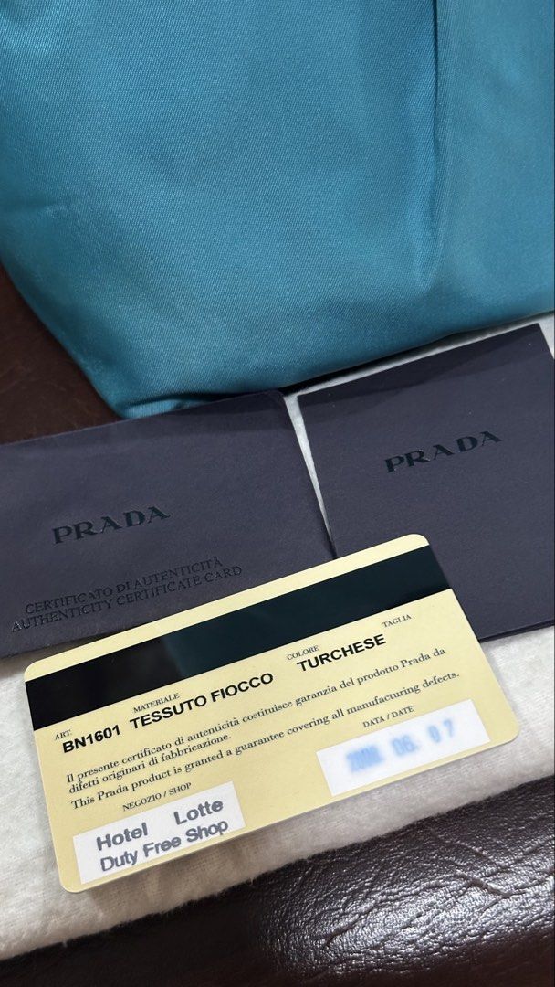 Authentic Prada Nylon Tote (Category: Luxury Bags & Wallets) located in Las Pinas. Submitted by marshmallowmax (Listing ID 1462142336, Image 2). Description: Excellent used! Minimal signs of usage, no flaws.. With dustbag and cards.