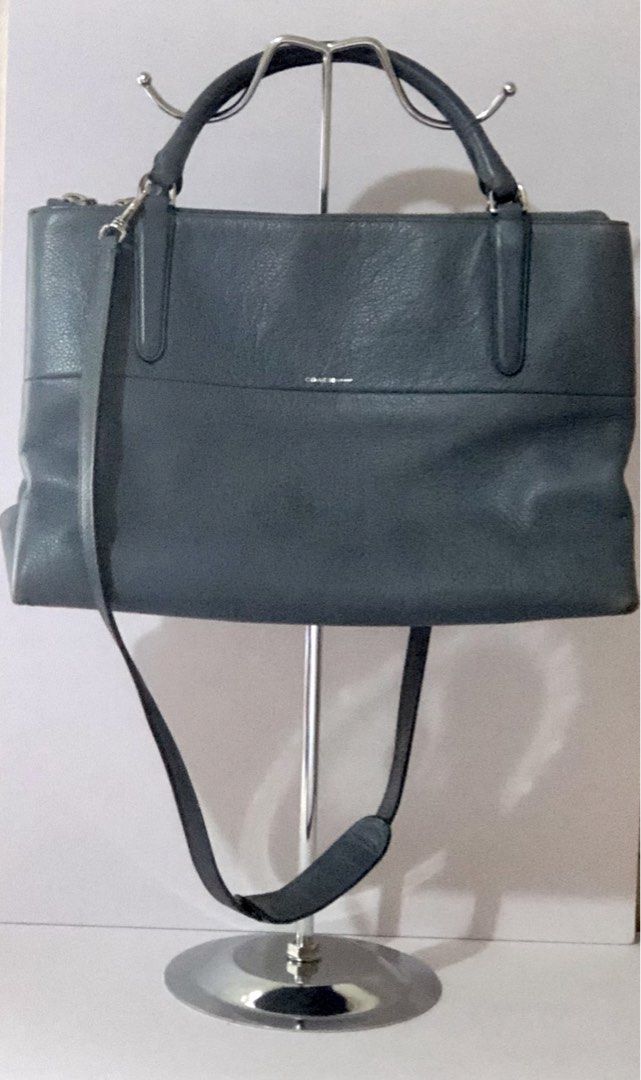 Authentic Pre-Owned Coach Leather Bag (Category: Cross-body Bags) located in Quezon City. Submitted by jingd (Listing ID 1462097529, Image 1). Description: - Authentic pre-owned Coach leather bag - Genuine pebbled leather in light blue - Dual top grab handles - Detachable and adjustable crossbody strap with shoulder pad - Spacious zippered 3 compartments - Minimalist silver foil stamped Coach logo - Video showcasing all details will be posted on 