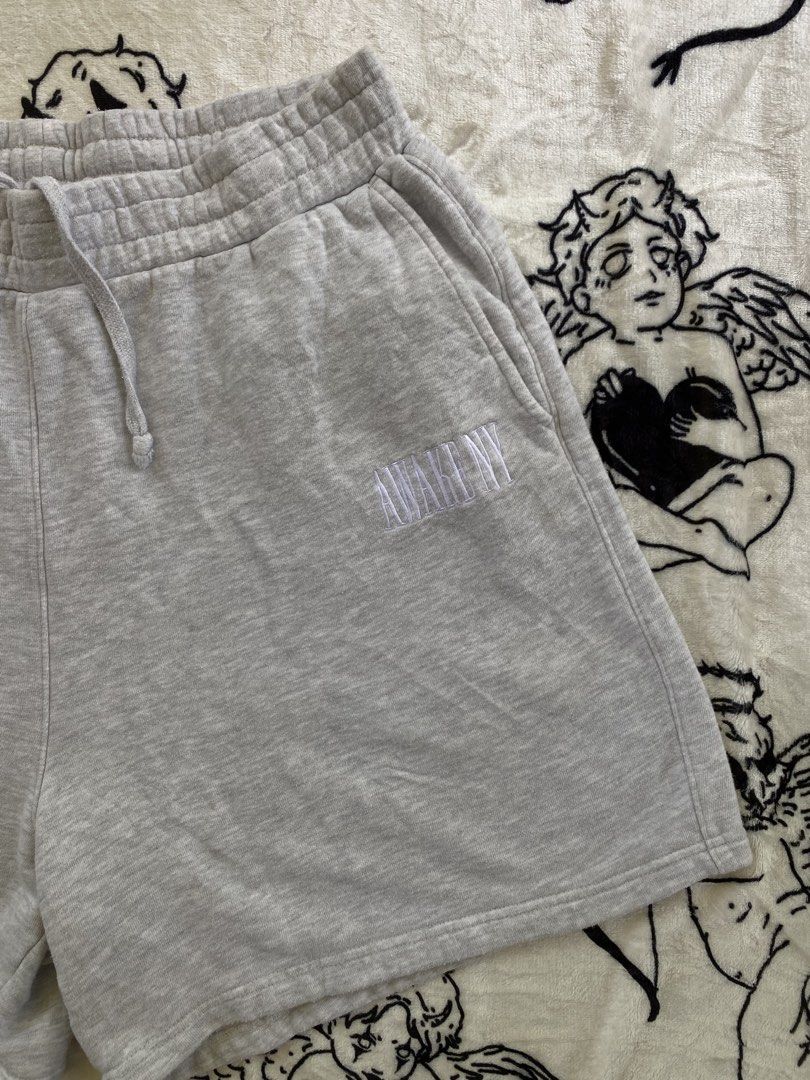 AWAKE NY Grey Sweat Shorts Size L (Category: Shorts) located in Cagwait. Submitted by roundsociety_ph (Listing ID 1462218031, Image 2). Description: - Brand: AWAKE NY - Color: Grey - Style: Sweat Shorts - Size: L - Features: Embroidered logo on left leg, elastic waistband with drawstring, two side pockets - Origin: Made in China.