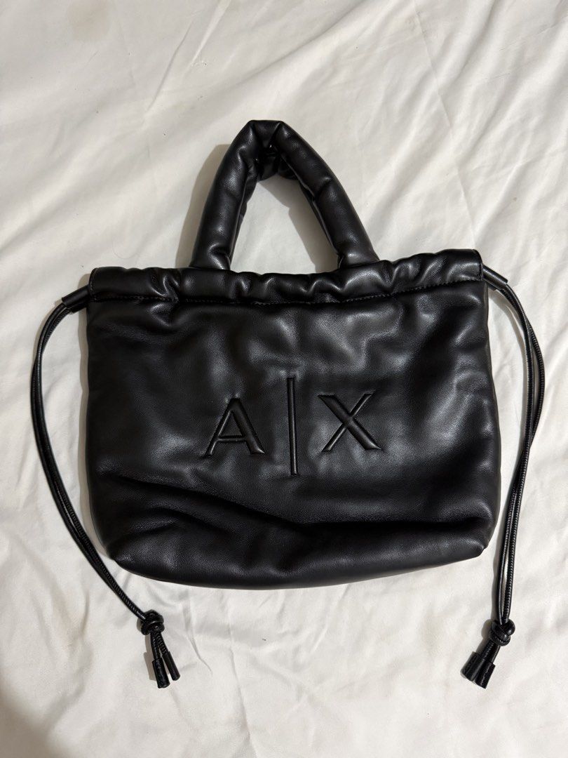 AX Armani Exchange Black Leather Tote Bag (Category: Luxury Bags & Wallets) located in Paranaque City. Submitted by coleencusi96 (Listing ID 1462072140, Image 1). Description: AX Armani Exchange black leather drawstring tote bag Bought in Japan.
