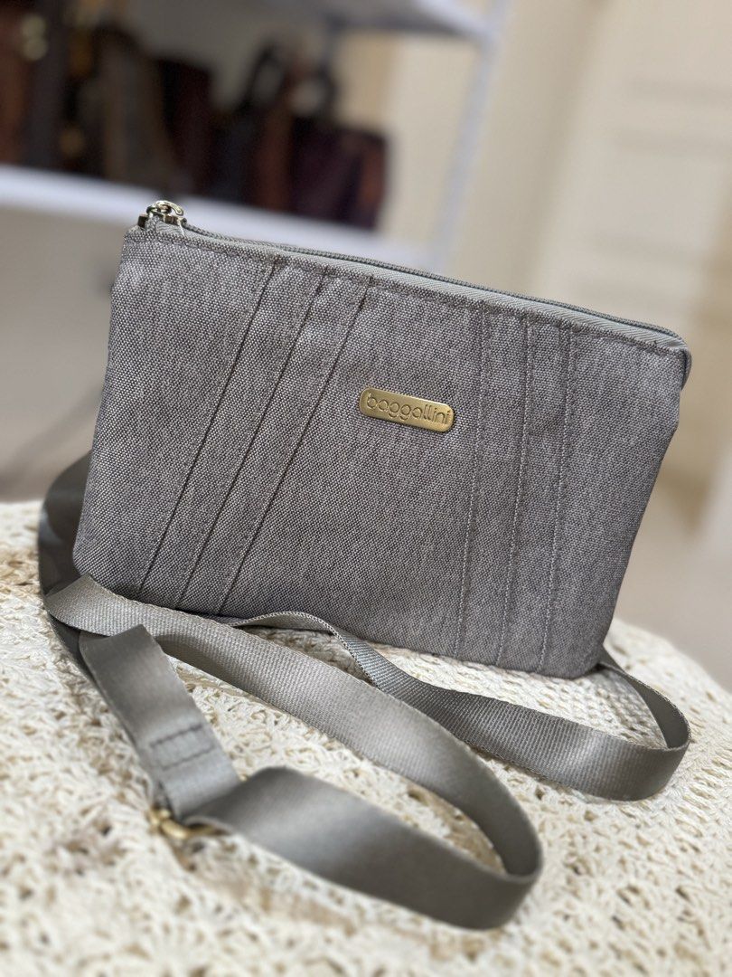 Baggallini Grey Canvas Crossbody Bag (Category: Cross-body Bags) located in Bacolod City. Submitted by vintage_vogue6100 (Listing ID 1462140752, Image 2). Description: - Brand: Baggallini - Color: Grey - Material: Canvas - Closure: Zippered - Strap: Adjustable crossbody strap - Features: Textured fabric, - Size: Small and compact, perfect for carrying essentials.