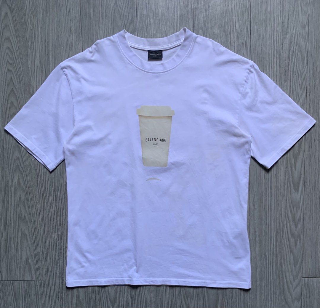 Balenciaga Coffee Cup T-Shirt (Category: Luxury Apparel) located in Pozorrubio. Submitted by plco. (Listing ID 1462163764, Image 1). Description: Balenciaga Coffee Cup T-Shirt XS on tag 21x27 color rate: 10/10 complete tags excellent condition no issue.