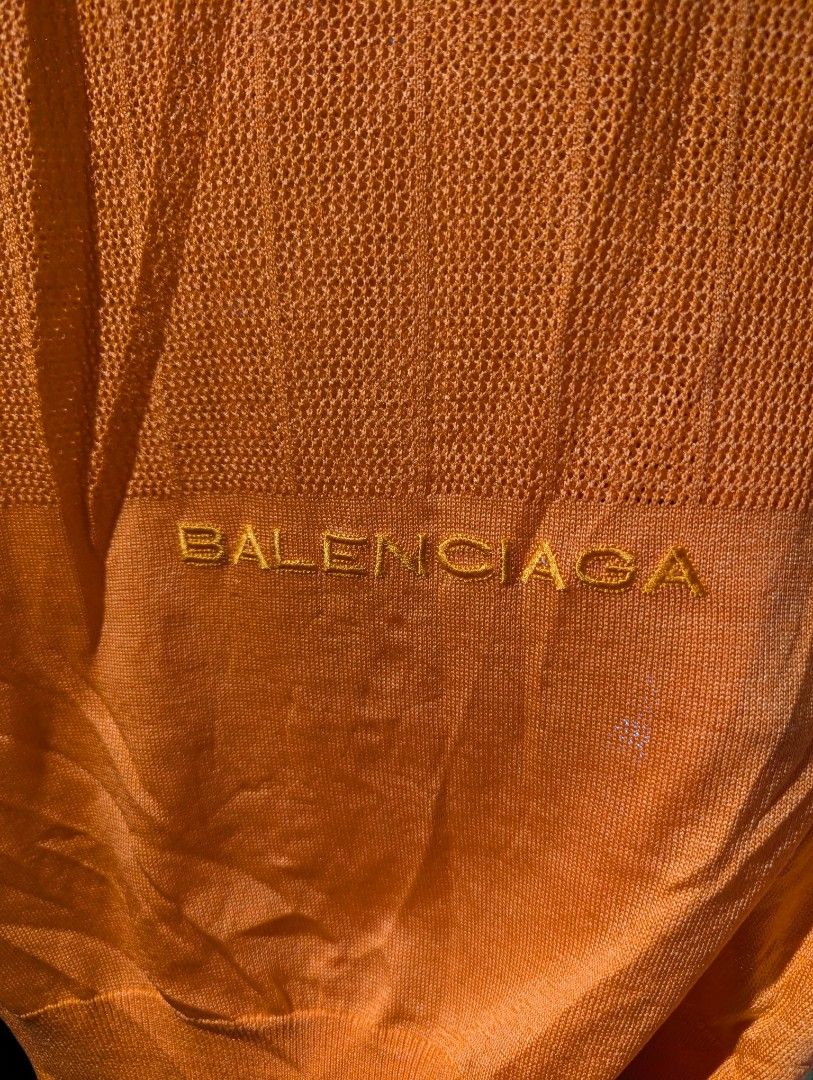Balenciaga Orange Knit Logo Vest (Category: Vests) located in Manila. Submitted by roblesniks33584 (Listing ID 1462052018, Image 2). Description: - Authentic Balenciaga orange knit vest - Features embroidered Balenciaga logo on the front - Sleeveless design - Versatile for layering or standalone wear - Refer to tag for exact sizing.