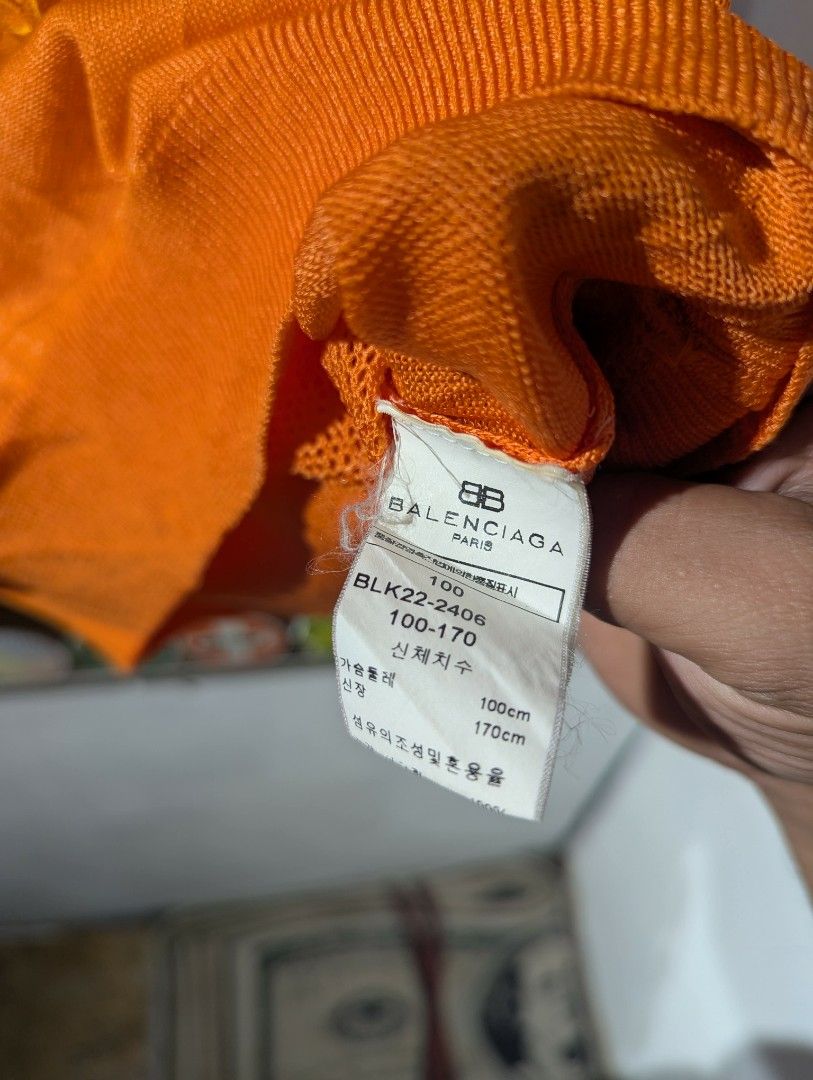 Balenciaga Orange Knit Logo Vest (Category: Vests) located in Manila. Submitted by roblesniks33584 (Listing ID 1462052018, Image 3). Description: - Authentic Balenciaga orange knit vest - Features embroidered Balenciaga logo on the front - Sleeveless design - Versatile for layering or standalone wear - Refer to tag for exact sizing.