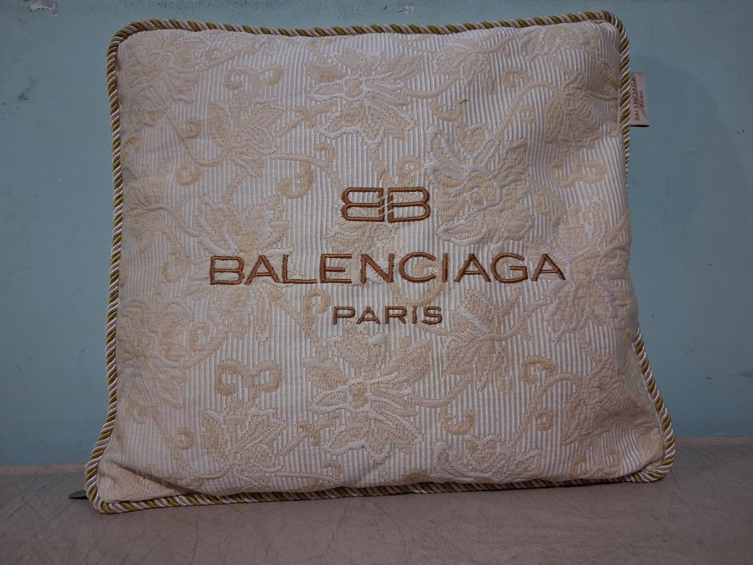 Balenciaga Paris Embroidered Cushion (Category: Looking For) located in Hinigaran. Submitted by faye_fab (Listing ID 1462133740, Image 1). Description: - Authentic Balenciaga Paris cushion - Elegant cream and gold color scheme - Features embroidered logo and beautiful floral pattern - Finished with a sophisticated rope trim around the edges - Ideal accent piece for home decor.