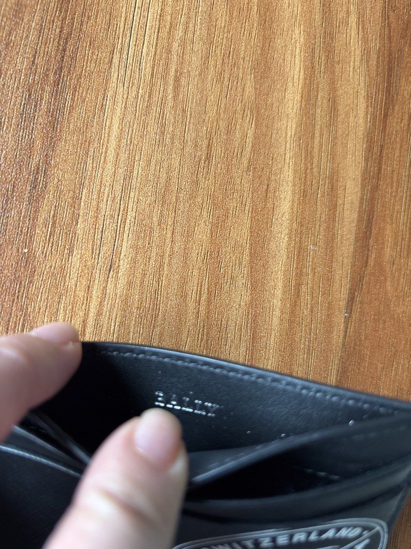 Bally Black Leather Card Holder (Category: Wallets & Card Holders) located in Manila. Submitted by pugo_08_08_08 (Listing ID 1462045179, Image 3). Description: - Authentic Bally card holder - Black textured leather - Classic Bally logo on the front - Multiple card slots inside - Made in Switzerland - Ideal for card organization.