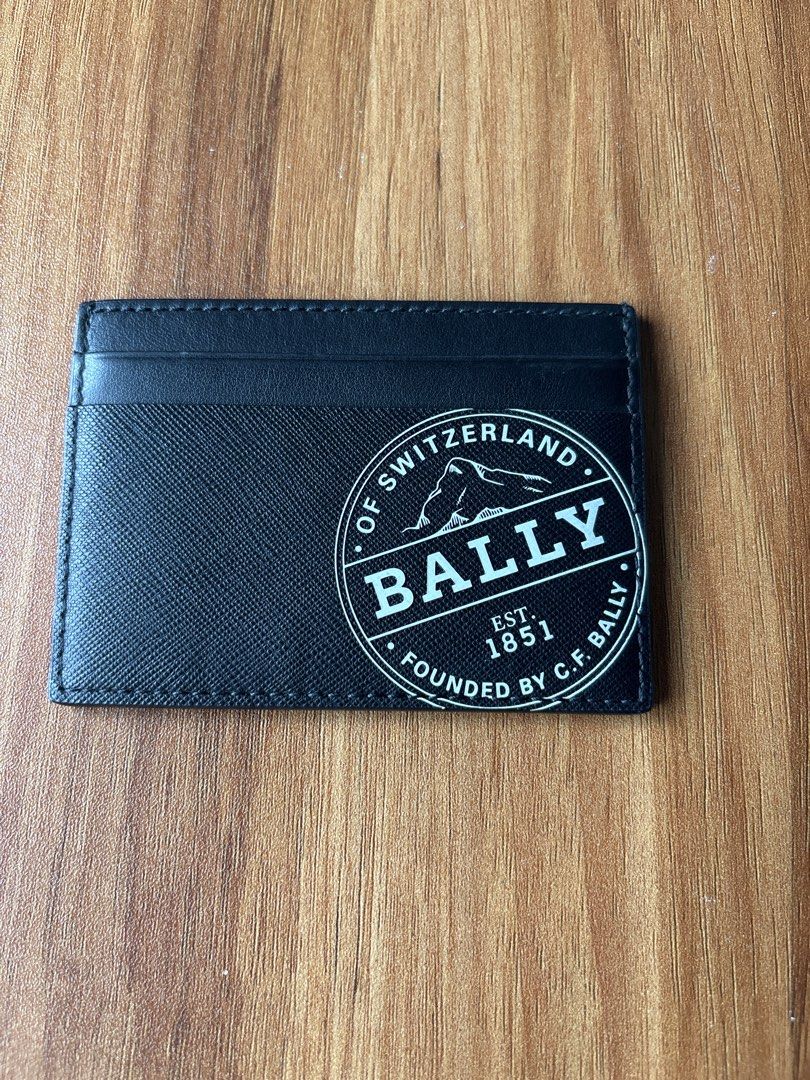 Bally Black Leather Card Holder (Category: Wallets & Card Holders) located in Manila. Submitted by pugo_08_08_08 (Listing ID 1462045179, Image 1). Description: - Authentic Bally card holder - Black textured leather - Classic Bally logo on the front - Multiple card slots inside - Made in Switzerland - Ideal for card organization.