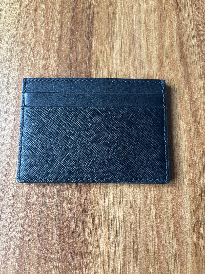 Bally Black Leather Card Holder (Category: Wallets & Card Holders) located in Manila. Submitted by pugo_08_08_08 (Listing ID 1462045179, Image 2). Description: - Authentic Bally card holder - Black textured leather - Classic Bally logo on the front - Multiple card slots inside - Made in Switzerland - Ideal for card organization.
