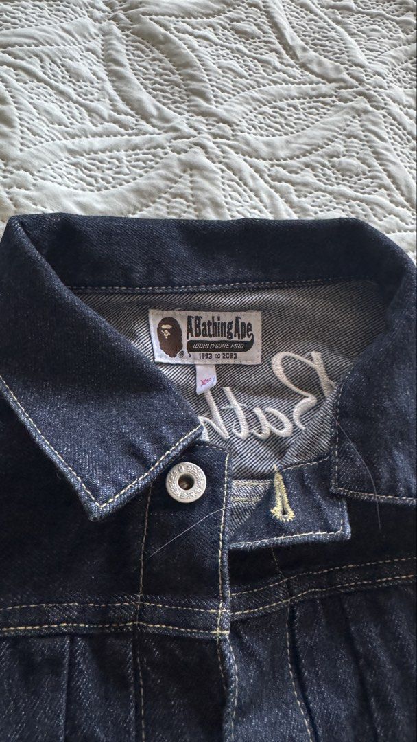 BAPE Denim Jacket Ice Cream Patch (Category: Coats, Jackets and Outerwear) located in Paranaque City. Submitted by sierraah (Listing ID 1462220244, Image 3). Description: - Brand: A Bathing Ape (BAPE) - Style: Blue Denim Jacket - Size: XS on tag -Bought in: Osaka, Japan -Never been used/worn - Features: Embroidered ice cream cone and logo on chest pocket - Back Detail: "A Bathing Ape" embroidery across the back - Closure: Button front and button 