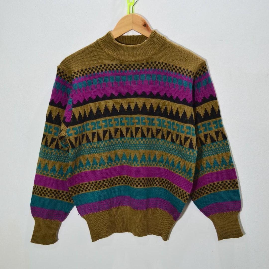 Be More Vintage Geometric Pattern Mock Neck Sweater Preloved (Category: Coats, Jackets and Outerwear) located in Polomolok. Submitted by lastthrift (Listing ID 1462202894, Image 2). Description: - Vintage Be More sweater - Unique geometric pattern in purple, teal, and black - Base color: warm brown/khaki - Mock neck style - Minor flaw: small hole on left sleeve near shoulder (visible in last photo) - Otherwise a unique and stylish piece - 20x23".