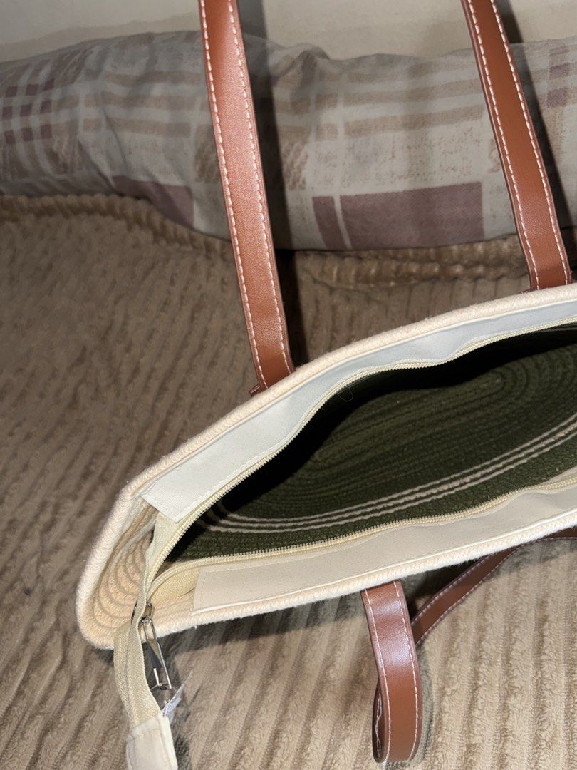 Beach bag (Category: Tote Bags) located in Pasay City. Submitted by christinetek (Listing ID 1462117083, Image 2). Description: - Cute woven tote bag - Green and white striped design - Faux leather handles - Secure zipper closure - Ideal for everyday use or beach trips - Spacious interior.