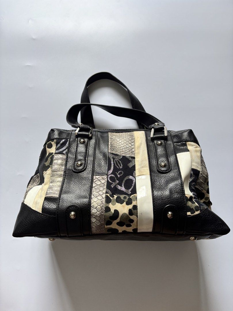 Bebe Patchwork Leather & Fabric Handbag (Category: Tote Bags) located in Manila. Submitted by anik.anik_ph (Listing ID 1462089456, Image 3). Description: - Unique patchwork design: Mix of black leather and patterned fabric. - Adorable heart-shaped tag with a key charm. - Convenient top handles for easy carrying. - Secure zip closure to keep your belongings safe. - Spacious interior, ideal for everyday essentials. - Stylish and practical for daily