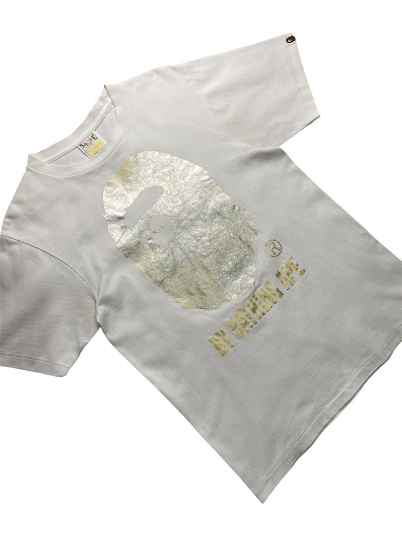 BIG HEAD GOLD (Category: Tshirts & Polo Shirts ) located in Cabanatuan. Submitted by rmsdnl (Listing ID 1462126021, Image 2). Description: BAPE BIG HEAD GOLD -Complete tags -Authentic Size s on tag best fit small Width:19 Length:25.5 Good Condition Color rate:9.3/10 Issue:need wash,stain,pin hole,Graphic fade Price:1299.