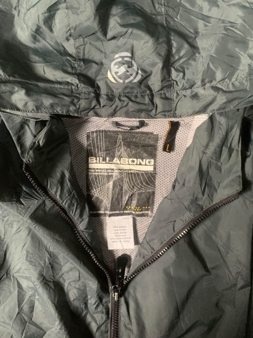 Billabong Active Systems Windbreaker Jacket (Category: Coats, Jackets and Outerwear) located in Tarlac. Submitted by rhandell_collectives (Listing ID 1462046126, Image 3). Description: - Billabong windbreaker jacket - Color: Dark Green - Size: L - Lightweight and packable design - Full zip front with hood - Billabong Active Systems logo on sleeve and chest - Ideal for outdoor activities and casual wear.