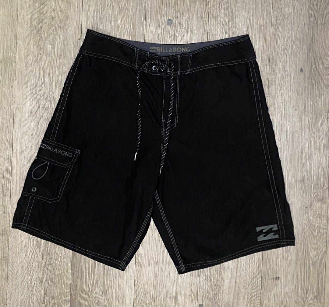 Billabong Black Board Shorts Size 32 (Category: Swim Trunks & Board Shorts) located in Manila. Submitted by owabaet12 (Listing ID 1462223332, Image 1). Description: - Brand: Billabong - Size: 32 - Color: Black - Features: Drawstring waist, velcro pocket on back left - Interior detail: Billabong logo printed on waistband - Origin: Made in China - Ideal for: Swimming, surfing.