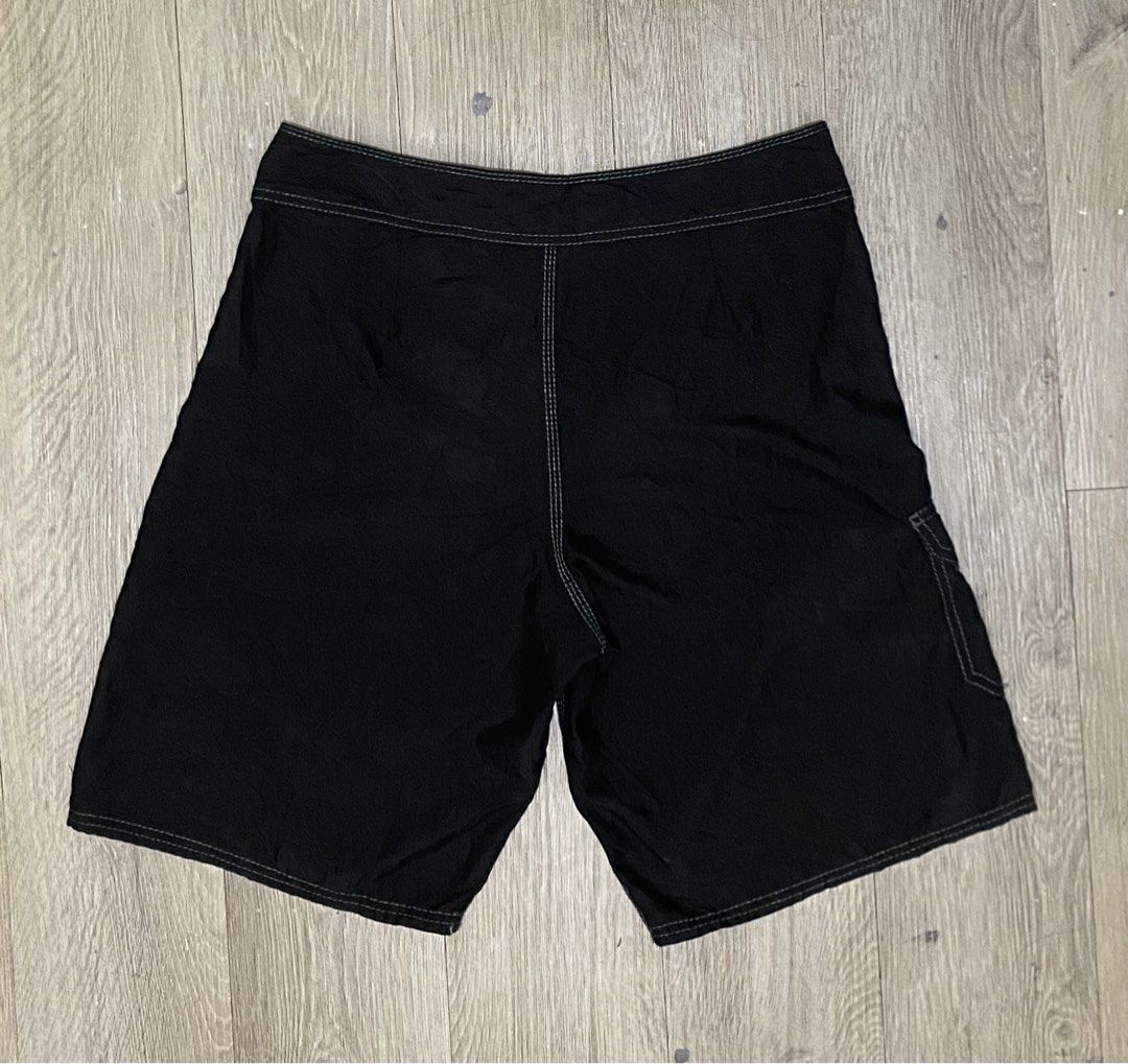 Billabong Black Board Shorts Size 32 (Category: Swim Trunks & Board Shorts) located in Manila. Submitted by owabaet12 (Listing ID 1462223332, Image 2). Description: - Brand: Billabong - Size: 32 - Color: Black - Features: Drawstring waist, velcro pocket on back left - Interior detail: Billabong logo printed on waistband - Origin: Made in China - Ideal for: Swimming, surfing.