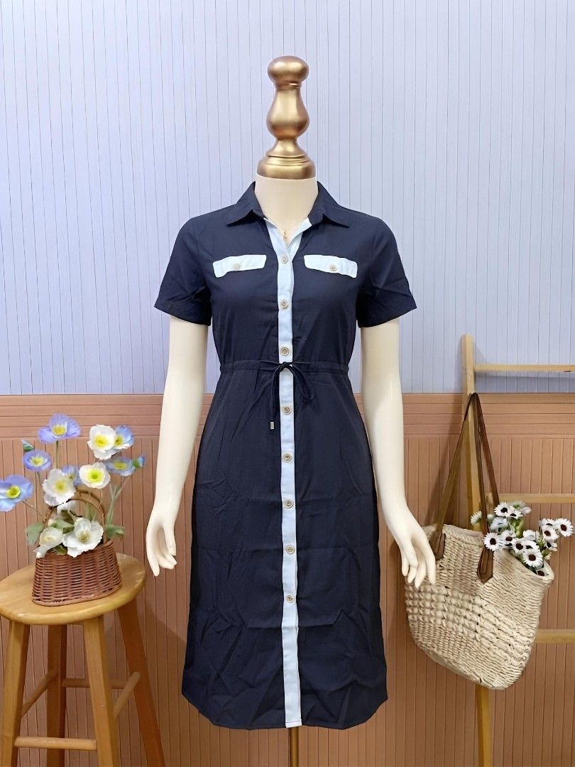 Black & White Contrast Button-Down Drawstring Shirt Dress (Category: Dresses) located in Roxas City. Submitted by blairnstyle (Listing ID 1462048920, Image 1). Description: ​Base Fabric & Color: Deep black structured woven cotton-blend fabric with crisp white contrast trimming ​Neckline & Collar: Spread shirt collar with a white inner placket framing a full-length button-down front ​Sleeves: Tailored short sleeves ​Chest & Waist Details: Dual fau
