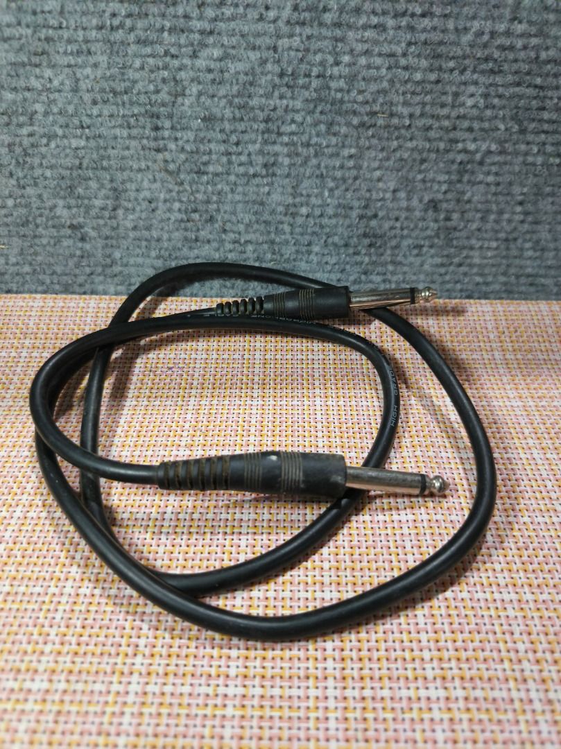 Black Audio Cable with 1/4 inch Jack Connectors (Category: Other Audio Equipment) located in San Leonardo. Submitted by burgossanleonardo.12345 (Listing ID 1462189159, Image 1). Description: - Black audio cable - Two 1/4 inch jack connectors (both ends) - Ideal for connecting instruments or audio equipment - Cable is neatly coiled - Fully functional with minor signs of use.