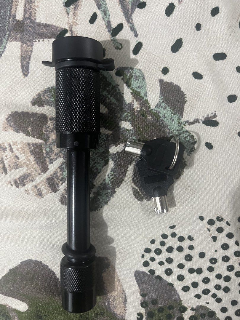 Black Hitch Lock with Keys for Trailer Hitch (Category: Body Parts and Accessories) located in Marikina City. Submitted by dpsantiago15062 (Listing ID 1462062429, Image 1). Description: - Black hitch lock set for trailer hitch security. - Includes lock pin and two keys. - Textured grip on pin for easy handling. - Rubber O-ring included to minimize rattle. - never been used, 5/8” mali lang size na nabili. - negotiable.