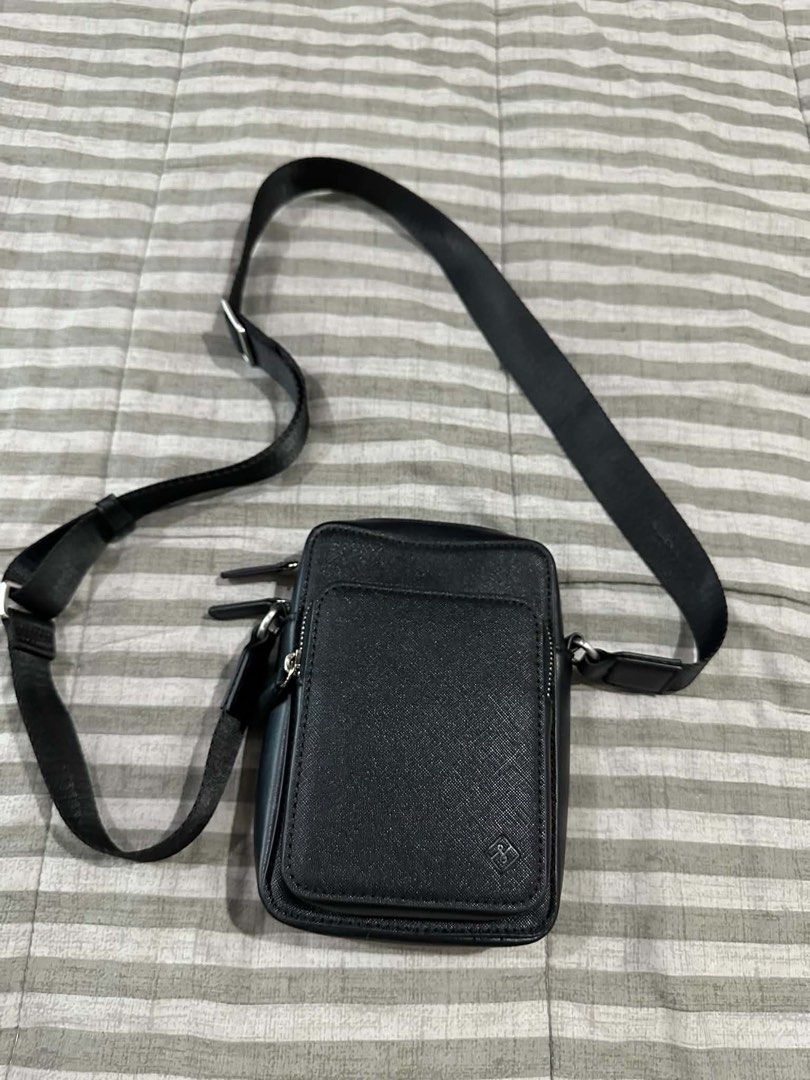 Black Leather Crossbody Bag with Adjustable Strap (Category: Sling Bags) located in Manila. Submitted by vingoodies (Listing ID 1462103493, Image 2). Description: - Stylish black crossbody bag - Made from durable faux leather - Main compartment for essentials - Convenient front pocket with flap closure - Adjustable strap for crossbody or shoulder wear - Elegant silver-tone hardware - Simple and versatile design for any outfit 500 each po 800 pag 