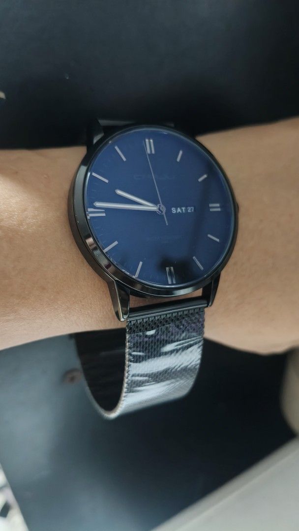 Black Mesh Strap Watch with Blue Dial (Category: Men's Watches) located in Taguig. Submitted by mercyeugen28914 (Listing ID 1462132811, Image 2). Description: - Stylish black watch with a captivating blue dial. - Convenient date display showing 'SAT 27'. - Modern black mesh strap for a comfortable fit. - Minimalist design with clean hour markers. - Water resistant for everyday durability. - Ideal for casual and daily wear..