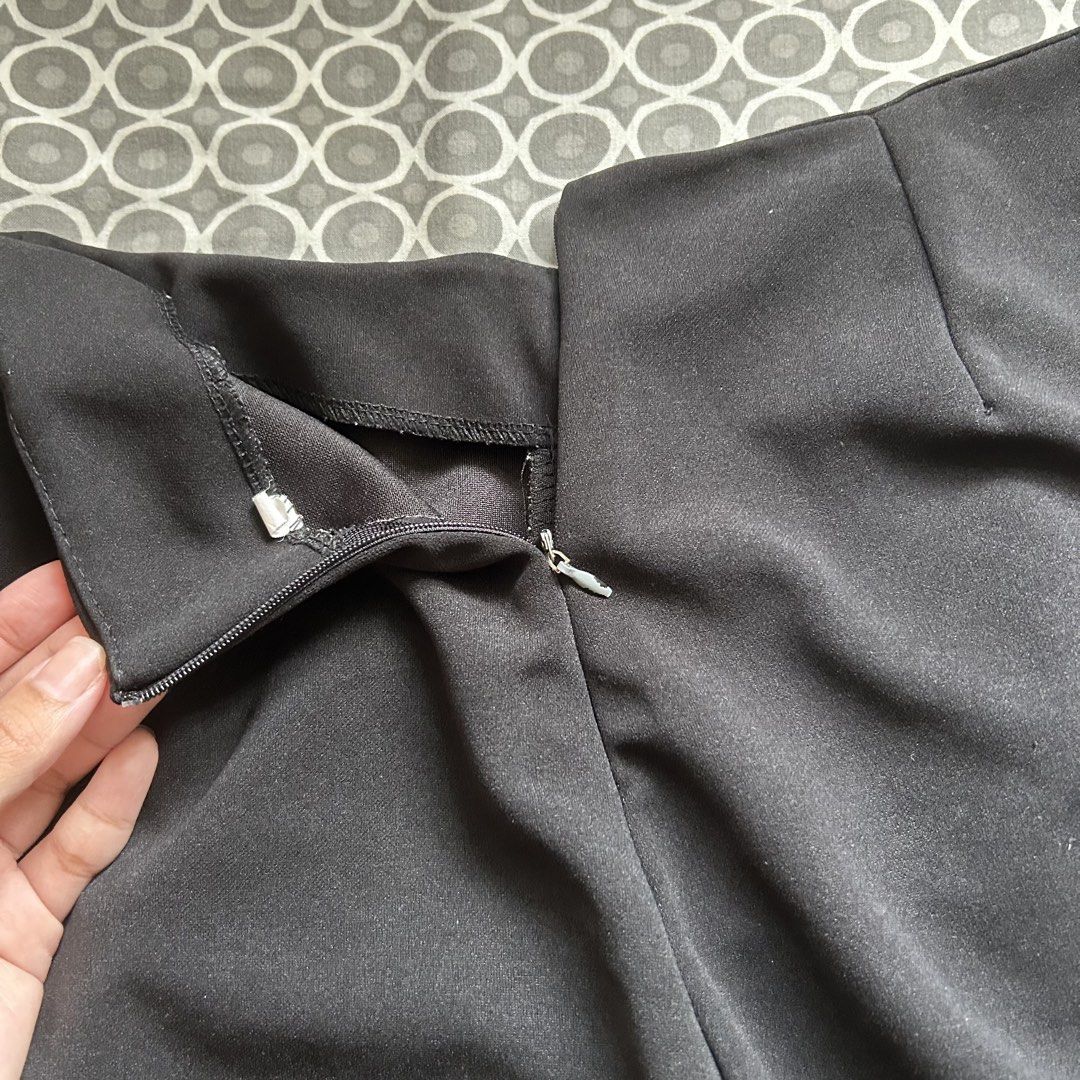Black Mini Skirt with Double Slits (Category: Skirts) located in Manila. Submitted by frances_001 (Listing ID 1462082478, Image 2). Description: - Classic black mini skirt - Convenient back zipper closure - Two stylish front slits - Versatile for dressing up or down - Effortlessly pairs with various tops.