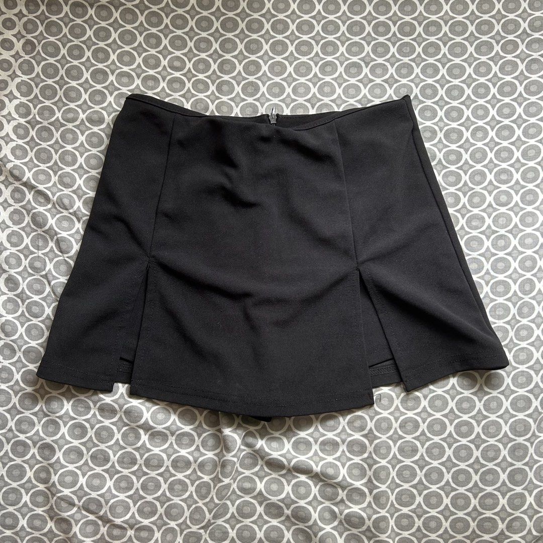 Black Mini Skirt with Double Slits (Category: Skirts) located in Manila. Submitted by frances_001 (Listing ID 1462082478, Image 1). Description: - Classic black mini skirt - Convenient back zipper closure - Two stylish front slits - Versatile for dressing up or down - Effortlessly pairs with various tops.