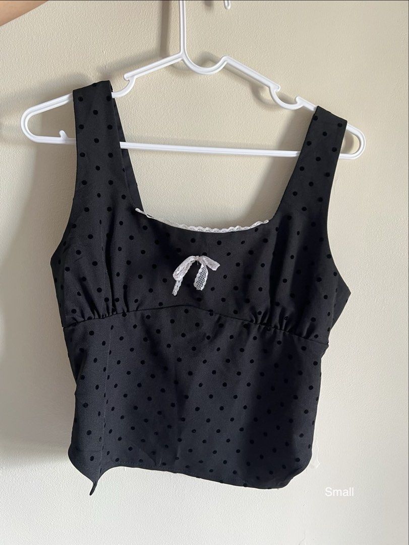 Black Polka Dot Square Neck Crop Top with Smocked Back (Category: Sleeveless) located in Manila. Submitted by francinemanaois (Listing ID 1462072216, Image 1). Description: - Cute black crop top - Square neckline - Subtle polka dot pattern - Small white bow detail at the front - Smocked back for a comfortable fit - Versatile for casual outings or nights out.