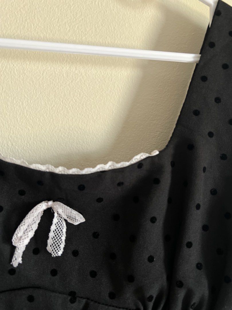 Black Polka Dot Square Neck Crop Top with Smocked Back (Category: Sleeveless) located in Manila. Submitted by francinemanaois (Listing ID 1462072216, Image 3). Description: - Cute black crop top - Square neckline - Subtle polka dot pattern - Small white bow detail at the front - Smocked back for a comfortable fit - Versatile for casual outings or nights out.
