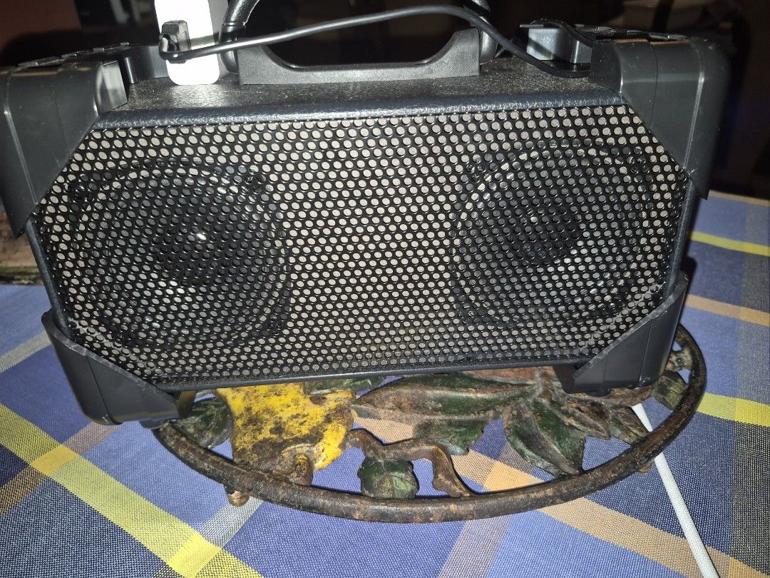 Black Portable Speaker with Handle (Category: Soundbars, Speakers & Amplifiers) located in Pasig City. Submitted by autumn329 (Listing ID 1462106673, Image 2). Description: - Black portable speaker - Sturdy handle for easy carrying - Mesh grill on front speaker cover - Compact size, ideal for personal use or small gatherings - Power cable included - Ready for a new home.