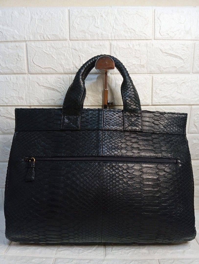 Black Python Leather Handbag with JRA Charm (Category: Tote Bags) located in Las Pinas. Submitted by etoksi1234 (Listing ID 1462126501, Image 2). Description: Pre-loved JRA black exotic leather handbag with double top handles and gold-tone turn-lock hardware, featuring a small triangular JRA (Japan Reptile Leather Industries Association) charm tag attached to the front. NO sling included..