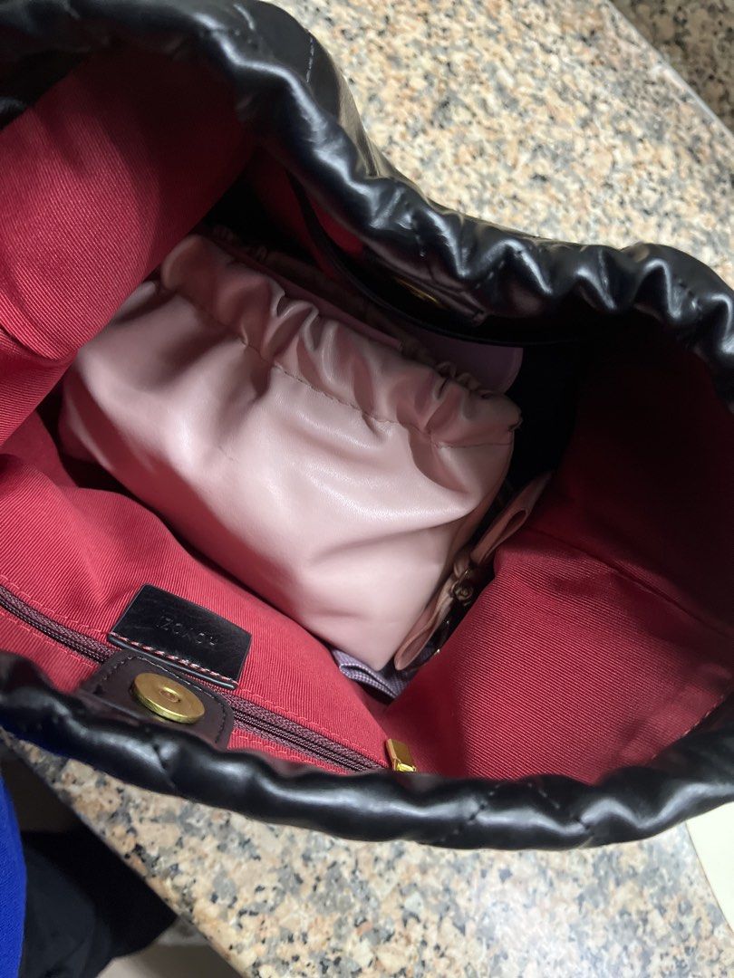 Black shoulder bag (Category: Luxury Bags & Wallets) located in Manila. Submitted by dethbalde01295 (Listing ID 1462189819, Image 3). Description: - Black quilted drawstring handbag - Gold chain strap - Comes with a small pink pouch inside - Adorned with a coin charm and cherry charm - Red interior - Interior zipper pocket - Magnetic snap closure.