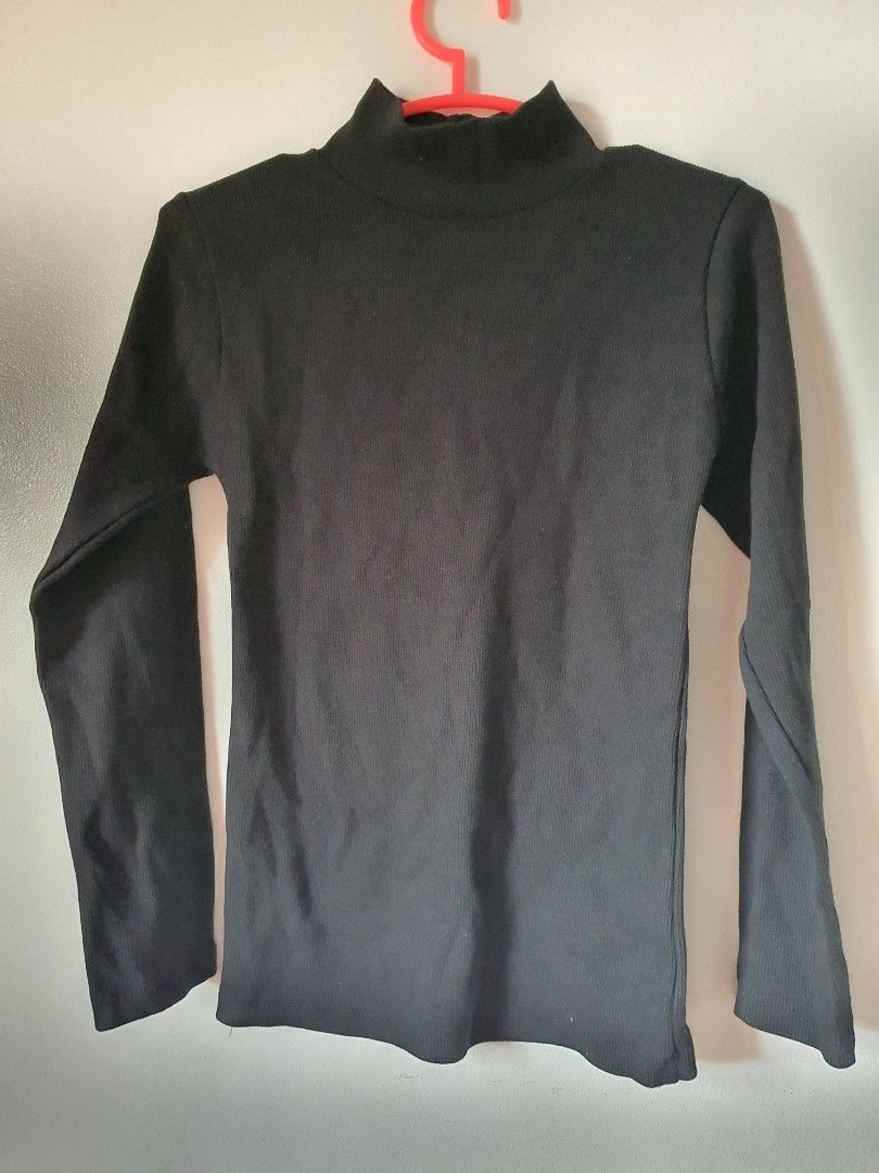 Black Ribbed Turtleneck Long Sleeve Top (Category: Longsleeves) located in Meycauayan. Submitted by shoptoown (Listing ID 1462079801, Image 1). Description: - Basic black ribbed turtleneck top - Long sleeves - Stretchy material for a comfortable fit - Measurements: Approx. 13" chest, 21" length - Ideal for layering or wearing as a standalone piece - A versatile addition to any wardrobe.