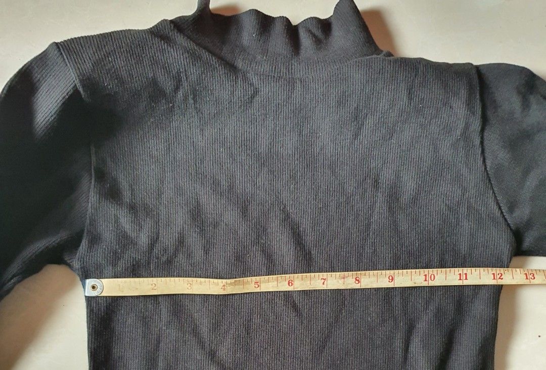 Black Ribbed Turtleneck Long Sleeve Top (Category: Longsleeves) located in Meycauayan. Submitted by shoptoown (Listing ID 1462079801, Image 2). Description: - Basic black ribbed turtleneck top - Long sleeves - Stretchy material for a comfortable fit - Measurements: Approx. 13" chest, 21" length - Ideal for layering or wearing as a standalone piece - A versatile addition to any wardrobe.
