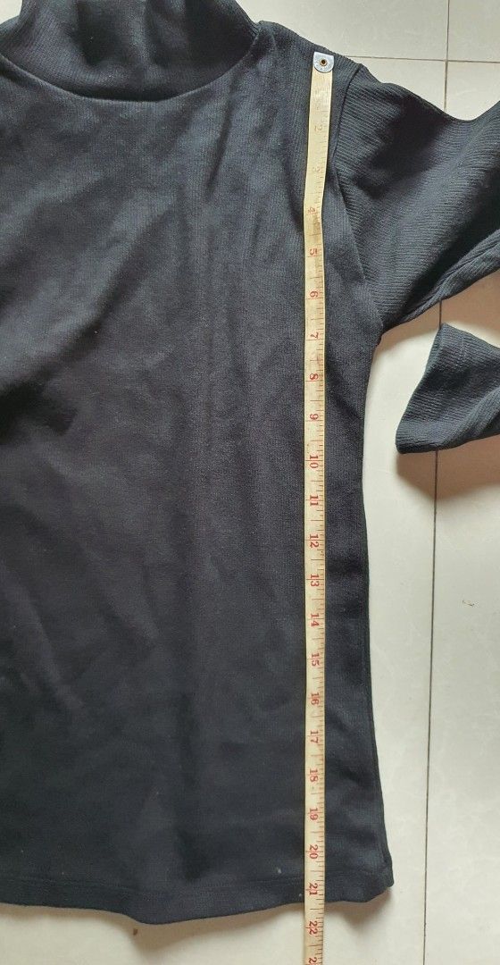 Black Ribbed Turtleneck Long Sleeve Top (Category: Longsleeves) located in Meycauayan. Submitted by shoptoown (Listing ID 1462079801, Image 3). Description: - Basic black ribbed turtleneck top - Long sleeves - Stretchy material for a comfortable fit - Measurements: Approx. 13" chest, 21" length - Ideal for layering or wearing as a standalone piece - A versatile addition to any wardrobe.