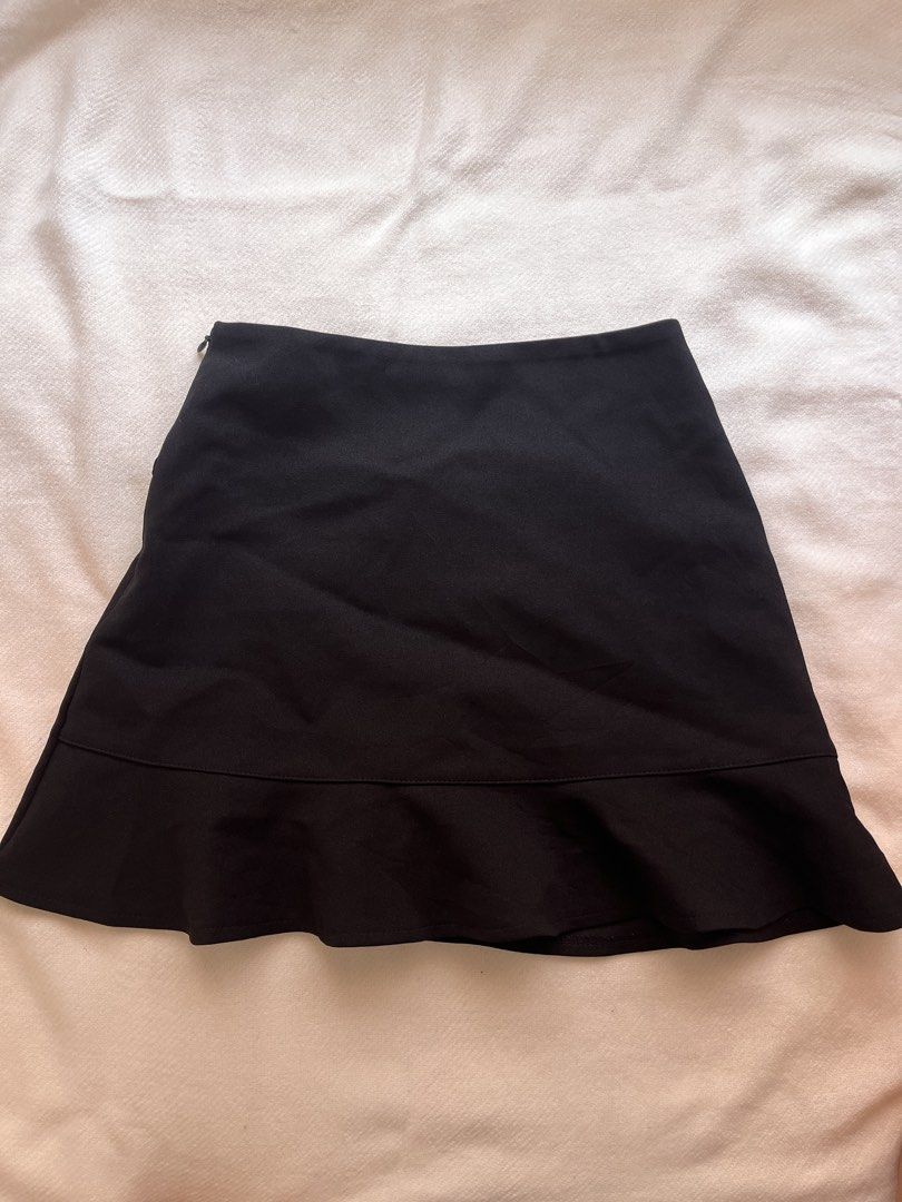 Black Ruffle Hem Mini Skirt (Category: Skirts) located in Manila. Submitted by chimcheese (Listing ID 1462134025, Image 1). Description: - Cute black mini skirt - Features a ruffle hem detail - Side zipper closure - Perfect for dressing up or down - Easy to pair with various tops.
