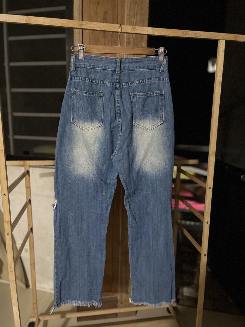 Blue Distressed Ripped Wide Leg Jeans (Category: Jeans) located in Caloocan City. Submitted by decluttering.101_ (Listing ID 1462122995, Image 2). Description: - Trendy wide-leg blue denim jeans - Distressed detailing and knee rips for a cool look - Frayed hem adds a touch of edge - Classic five-pocket styling - Secure button and zip closure.