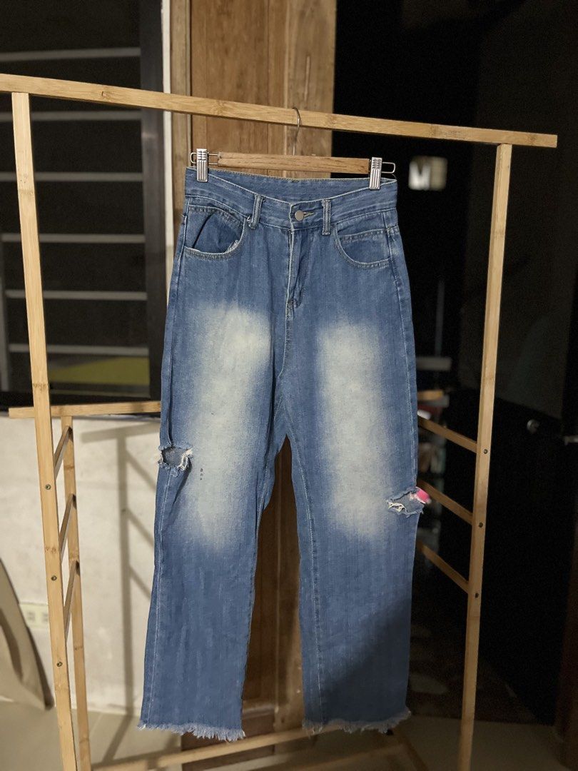 Blue Distressed Ripped Wide Leg Jeans (Category: Jeans) located in Caloocan City. Submitted by decluttering.101_ (Listing ID 1462122995, Image 1). Description: - Trendy wide-leg blue denim jeans - Distressed detailing and knee rips for a cool look - Frayed hem adds a touch of edge - Classic five-pocket styling - Secure button and zip closure.