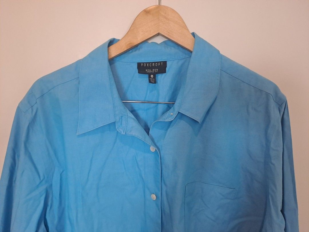 Foxcropt Blue dress or longsleve (Category: Maternity wear) located in Manila. Submitted by joanbalde39643 (Listing ID 1462174479, Image 2). Description: The shirt in the image appears to be a women's relaxed or plus-size button-up shirt in a bright turquoise or cerulean blue shade. It features a classic pointed collar, a front button placket, long sleeves with buttoned roll-up tabs, and a single left-chest patch pocket..