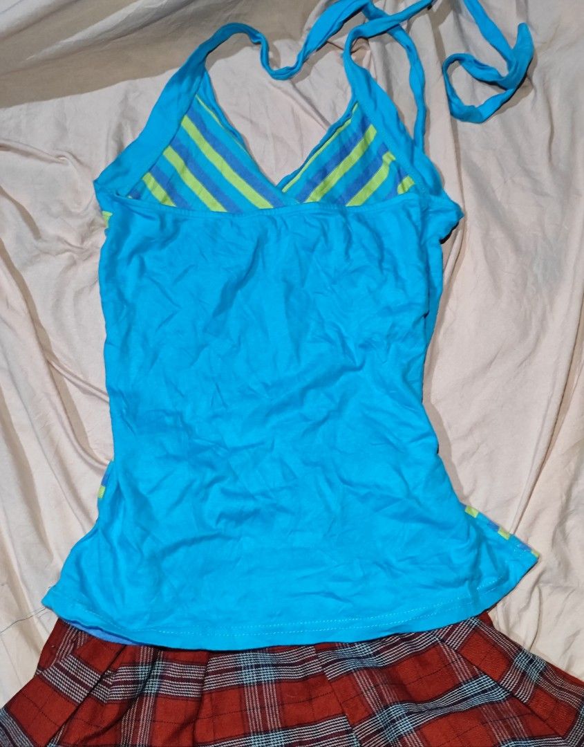 Blue striped camisole tie-strap top (Category: Sleeveless) located in Iloilo. Submitted by cynehllevie (Listing ID 1462118693, Image 2). Description: blue and lime-green striped camisole featuring a crossover V-neckline and adjustable tie-up straps. size xs-m.