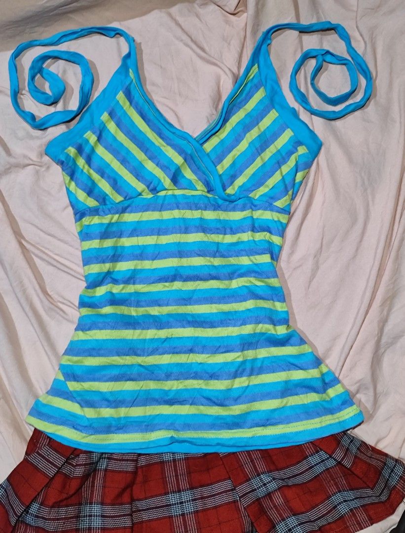 Blue striped camisole tie-strap top (Category: Sleeveless) located in Iloilo. Submitted by cynehllevie (Listing ID 1462118693, Image 1). Description: blue and lime-green striped camisole featuring a crossover V-neckline and adjustable tie-up straps. size xs-m.