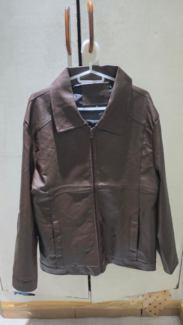 Brown Faux Leather Jacket (Category: Coats, Jackets and Outerwear) located in Quezon City. Submitted by luckycat_ddf3f0 (Listing ID 1462134941, Image 1). Description: - Classic brown faux leather jacket - Zip-up front - Two side pockets - Simple collar design - Perfect for casual wear or layering - Ideal for cooler weather -size Large.