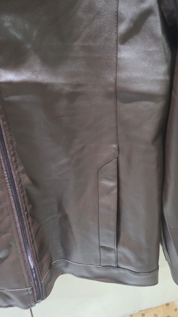 Brown Faux Leather Jacket (Category: Coats, Jackets and Outerwear) located in Quezon City. Submitted by luckycat_ddf3f0 (Listing ID 1462134941, Image 3). Description: - Classic brown faux leather jacket - Zip-up front - Two side pockets - Simple collar design - Perfect for casual wear or layering - Ideal for cooler weather -size Large.