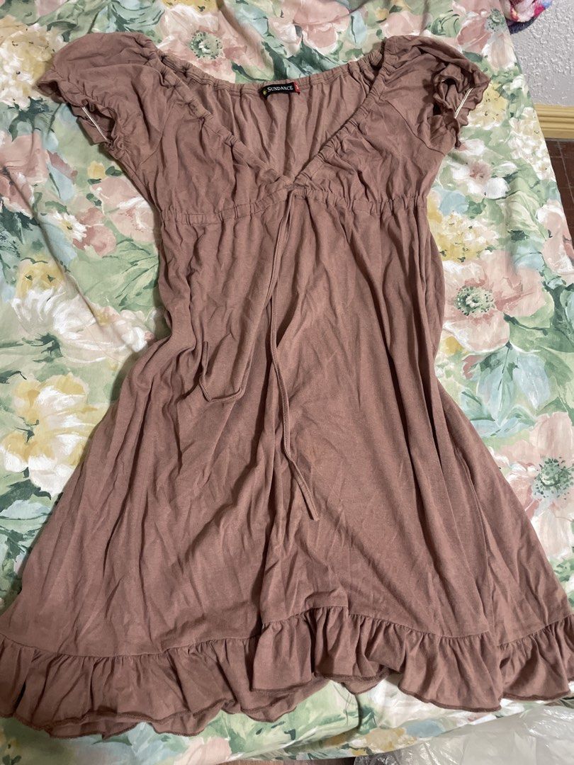 Brown Ruffle Hem Dress (Category: Dresses) located in Manila. Submitted by sapsari (Listing ID 1462194773, Image 1). Description: - Cute brown dress from Sundance - Size: Medium (M) - Short sleeves - Tie-front detail - Ruffled hem .
